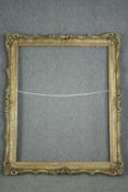 A large giltwood and gesso picture or mirror frame. H.150 W.120cm.
