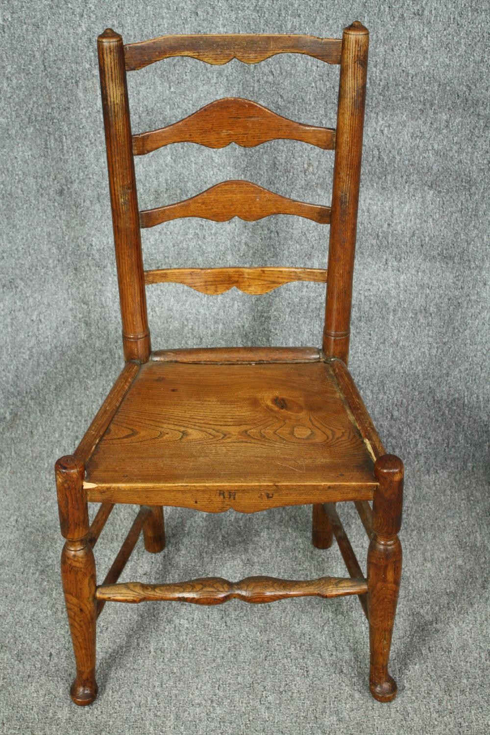 A pair of 18th century elm Lancashire ladderback dining chairs. - Image 2 of 7