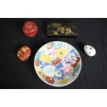 A Japanese hand painted flower plate along with a Persian lacquered box, a hand painted insect egg
