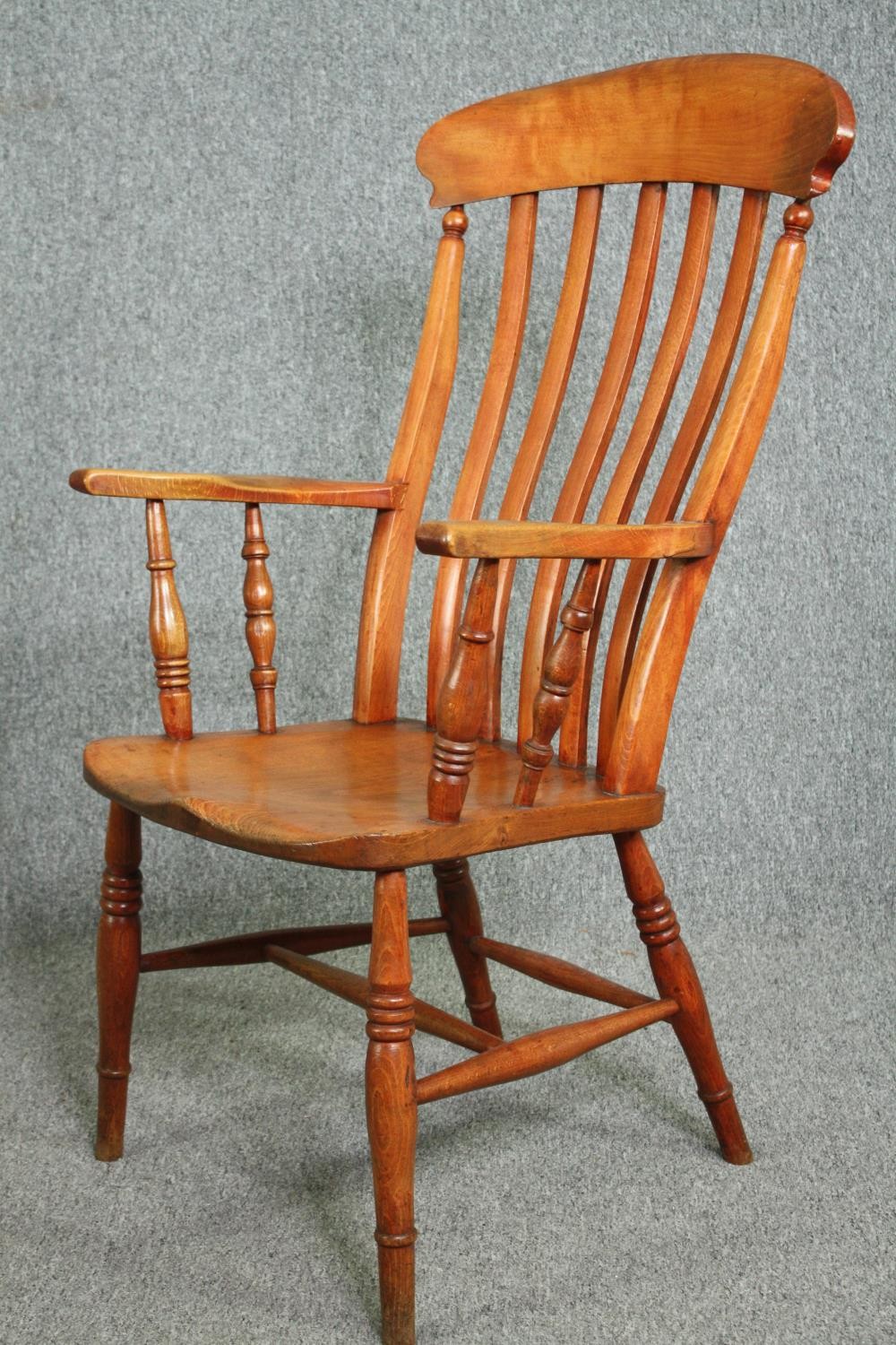 A 19th century elm seated bar back kitchen armchair. H.110cm. - Image 3 of 4