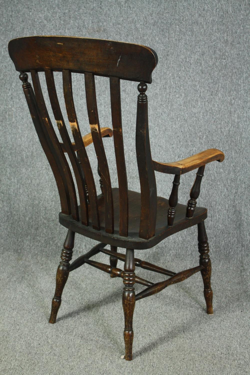 A 19th century beech and elm stick back kitchen armchair. H.114cm. - Image 4 of 5