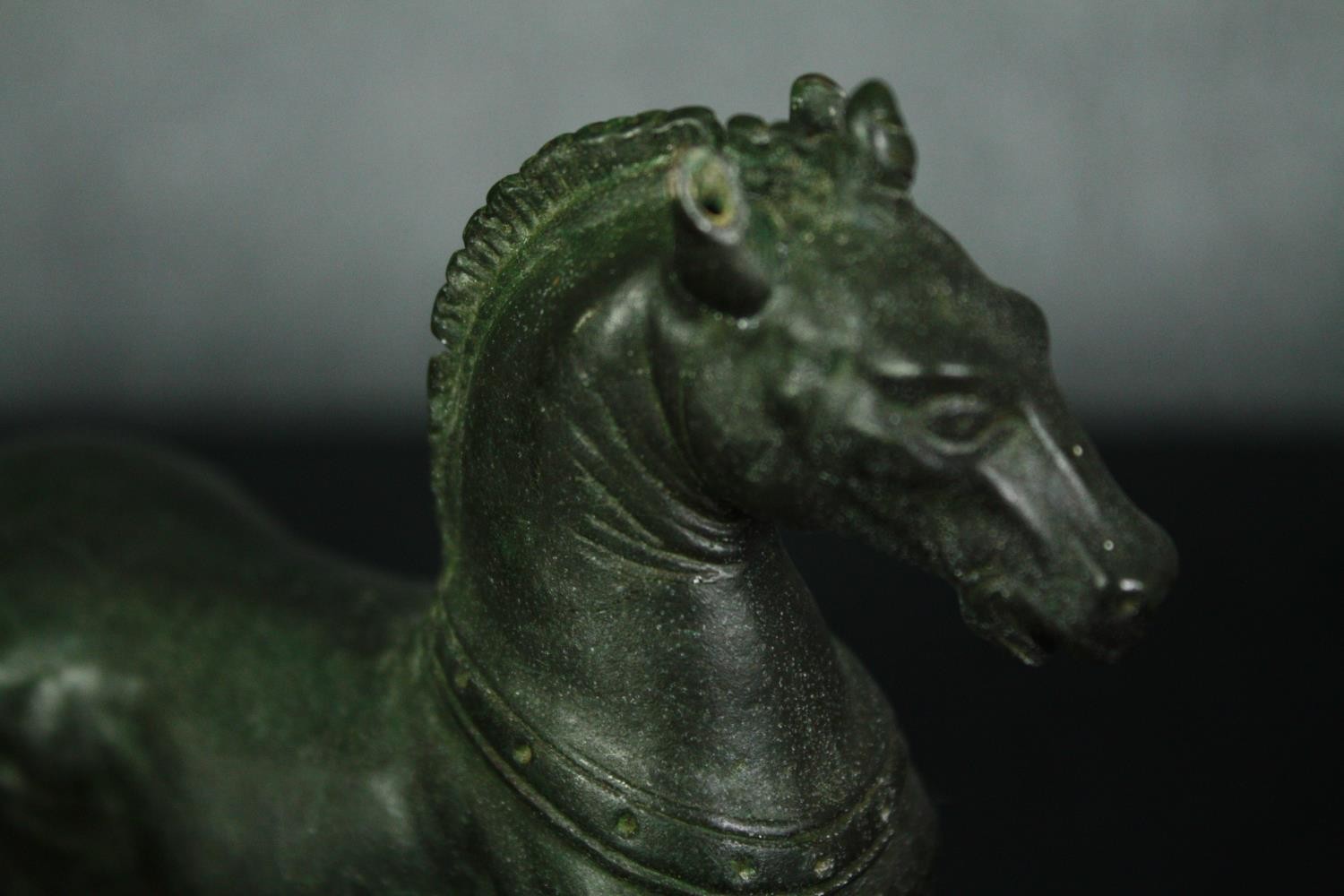 A bronze horse figure, a plaster faun mask and a brass figure. H.18 W.14cm. (largest). - Image 6 of 8
