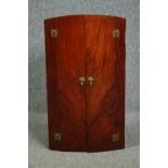 A mid century Art Deco style burr walnut hanging corner cabinet. H.72 W.40 D.24cm.