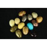 A collection of polished hardstone eggs including two hand decorated. H.7cm. (largest)