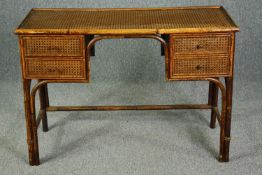 A vintage cane and bamboo writing or dressing table. H.75 W.107 D.44cm.