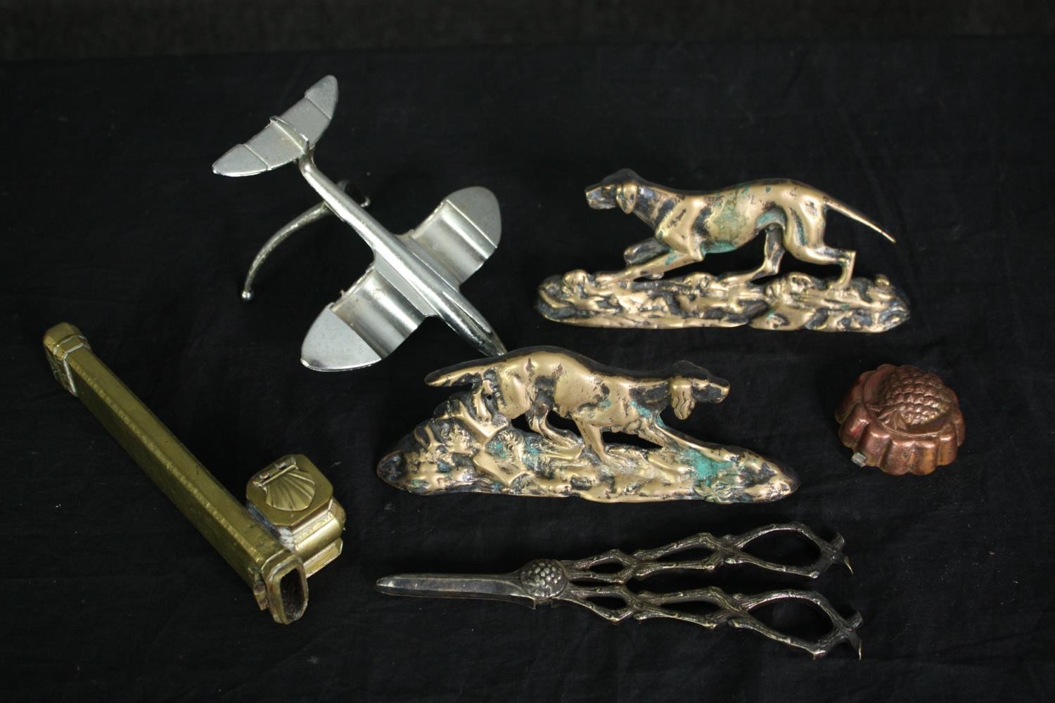A vintage aluminium model aeroplane along with other metalware and silver plate. L.17cm. (largest)