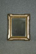 A 19th century wall mirror in glazed and gesso frame with bevelled plate. H.66 W.55cm.