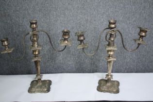 A pair of silver plated three branch table candelabras. H.42cm. (each)