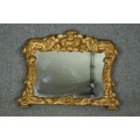 Mantel mirror of small size, 19th century foliate carved giltwood. H.61 W.74cm.