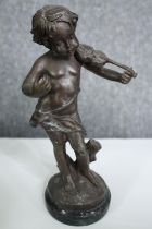 An early 20th century spelter figure, cherub with a violin, signed A Moreau. H.25cm.