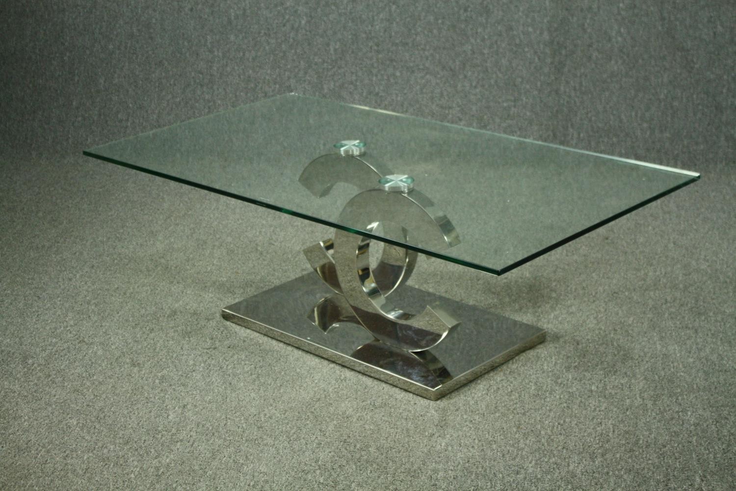 Coffee table, contemporary with plate glass top on a chrome base. H.42 W130cm. - Image 7 of 8