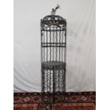 A full height wrought metal wine rack. H.185cm.