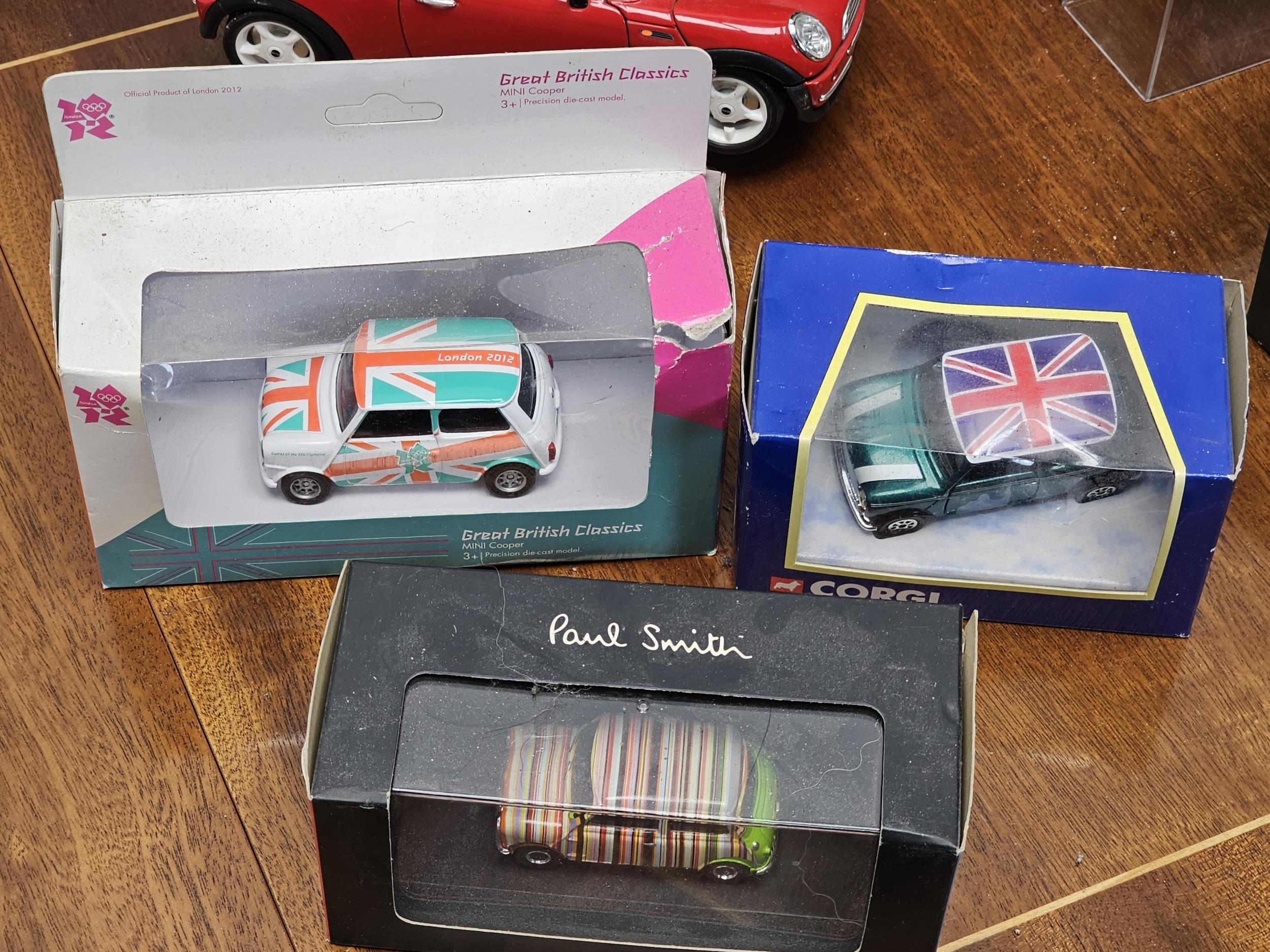 A collection of boxed vintage die-cast cars, Mini Coopers, Jaguar etc - Image 4 of 5