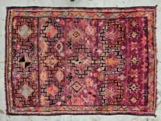 Carpet, Turkish with repeating geometric pattern within stylised borders. H.250 W.185cm.