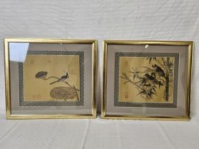 Two framed and glazed Japanese prints on silk. H.49 W.54cm.