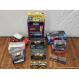 A collection of boxed vintage die-cast cars, Mini Coopers, Jaguar etc