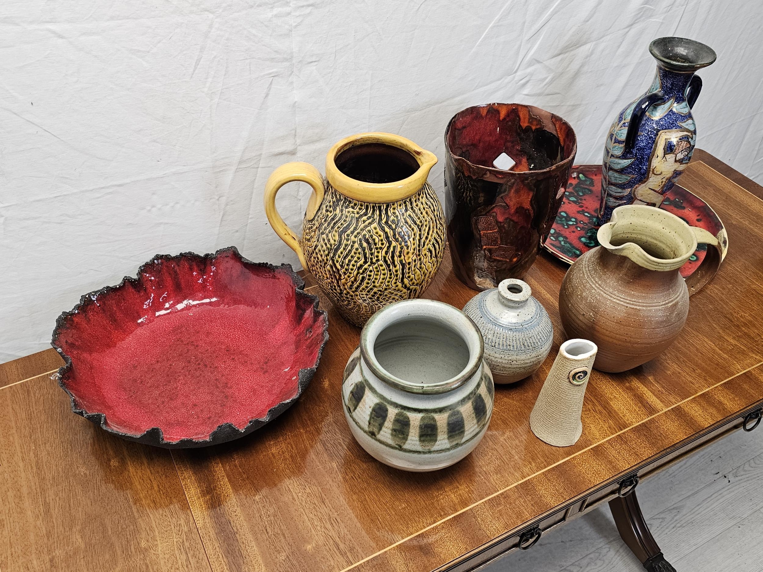 A miscellaneous collection of studio pottery, to include jugs, vases and plates. Tallest vase is - Image 4 of 5