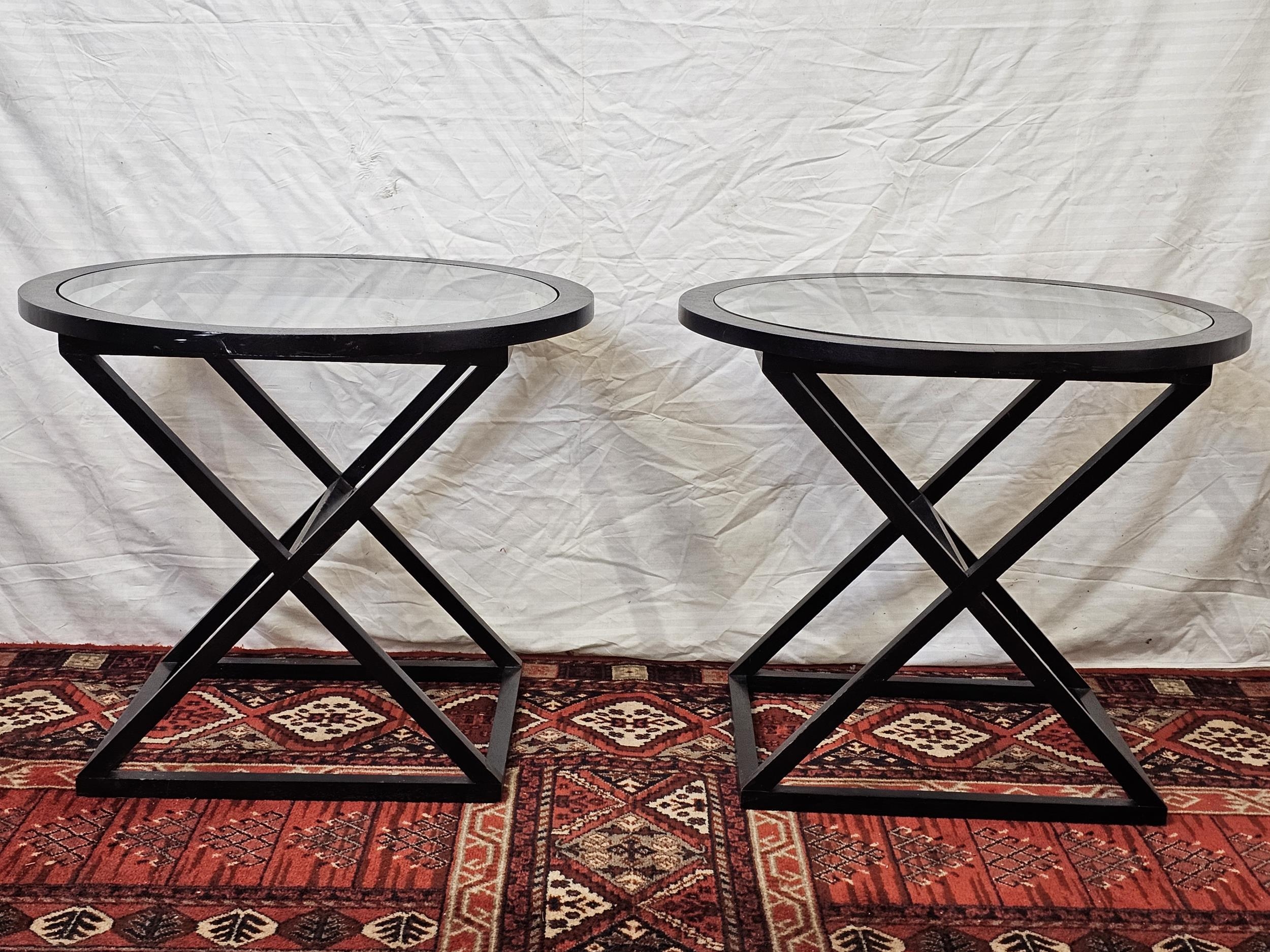 A pair of contemporary glass topped painted wood tables. H.60 W.70 D.70cm.