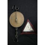 19th century brass hanging scales and an Art Deco mantel clock. L.60cm. (largest)