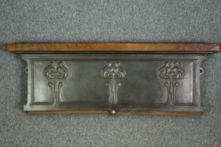 A late 19th century cast iron wall shelf with Art Nouveau motifs. H.36 W.109 D.13cm.