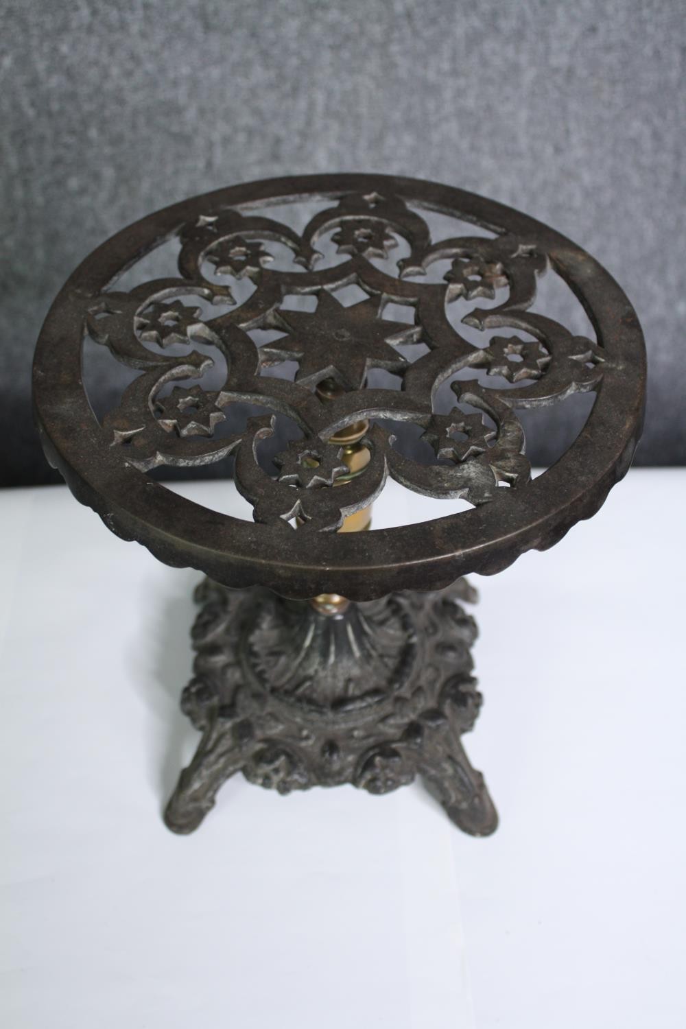 A 19th century brass and iron trivet in the form of a table and an embossed dish. H.26 Dia.26cm. ( - Image 2 of 5