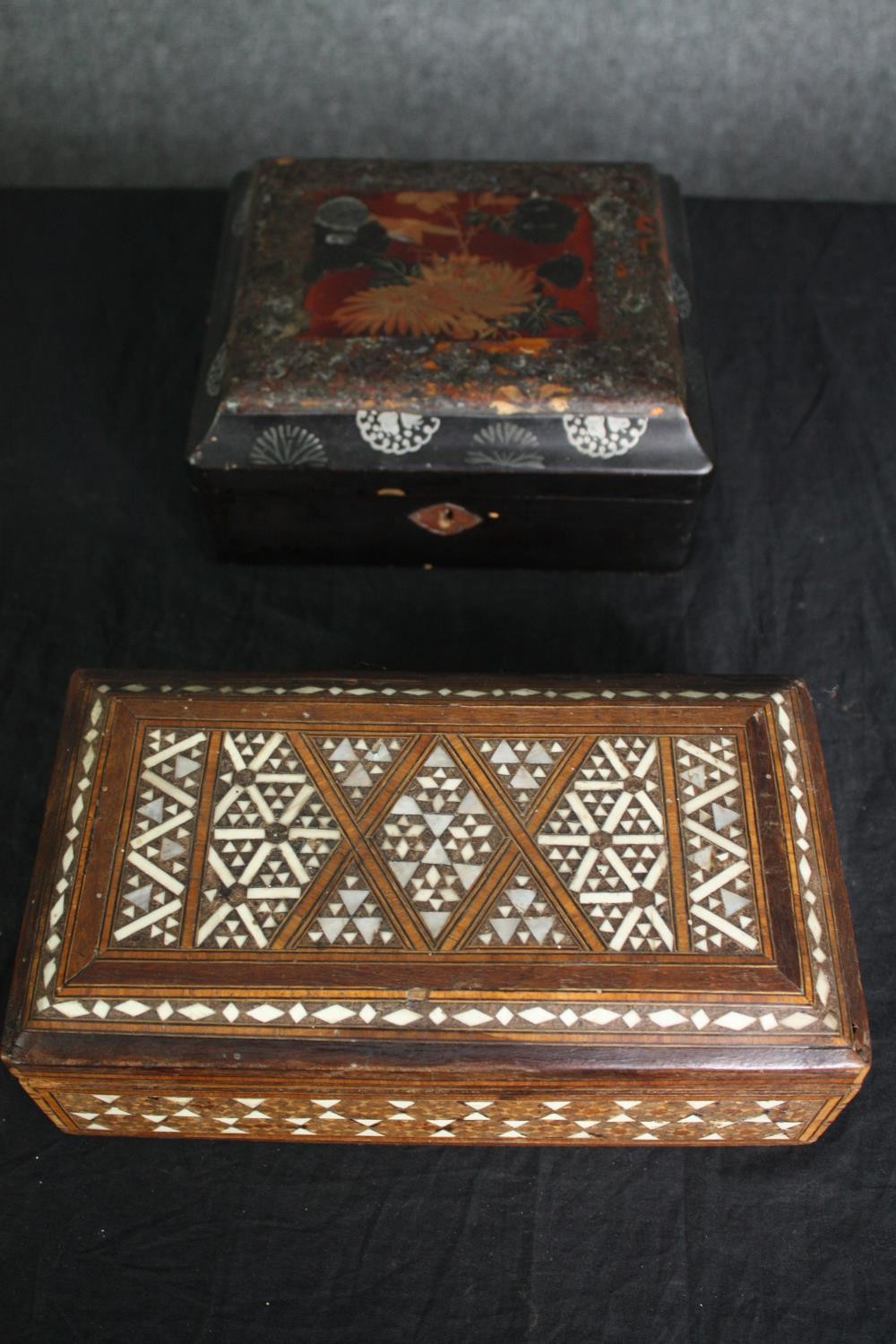 A Damascus inlaid box and a Chinese lacquered box. H.9 W.20 D.18cm. (largest)