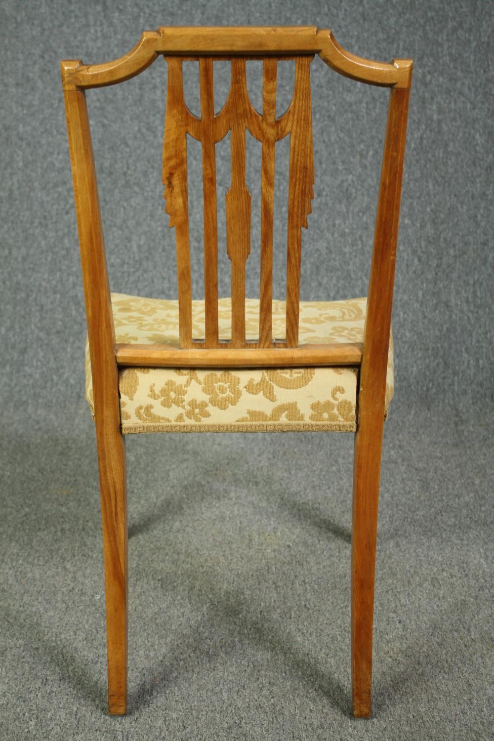 A set of eight Georgian style birch dining chairs to include two carver armchairs. (Repairs to the - Image 10 of 12