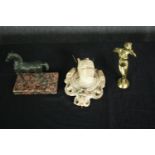 A bronze horse figure, a plaster faun mask and a brass figure. H.18 W.14cm. (largest).