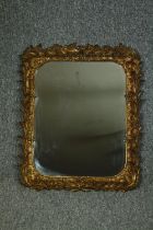 Wall mirror, 19th carved foliate giltwood frame. H.66 W.55cm.