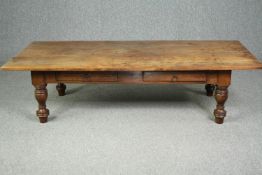 A large Indian teak coffee table. H.48 W.183 D.86cm.