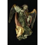 A carved and painted wall hanging Herald Angel. H.22 W.15cm.