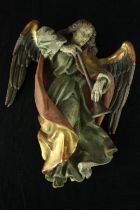A carved and painted wall hanging Herald Angel. H.22 W.15cm.