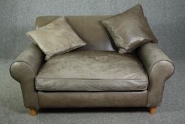 A contemporary small sofa (or large armchair) in leather upholstery. H.70 W.145 D.115cm.