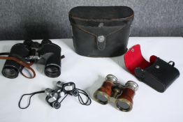 Three pairs of binoculars. H.17cm. (largest)