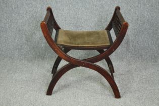 A late 19th century mahogany folding X frame stool. H.60 W.60 D.45cm.