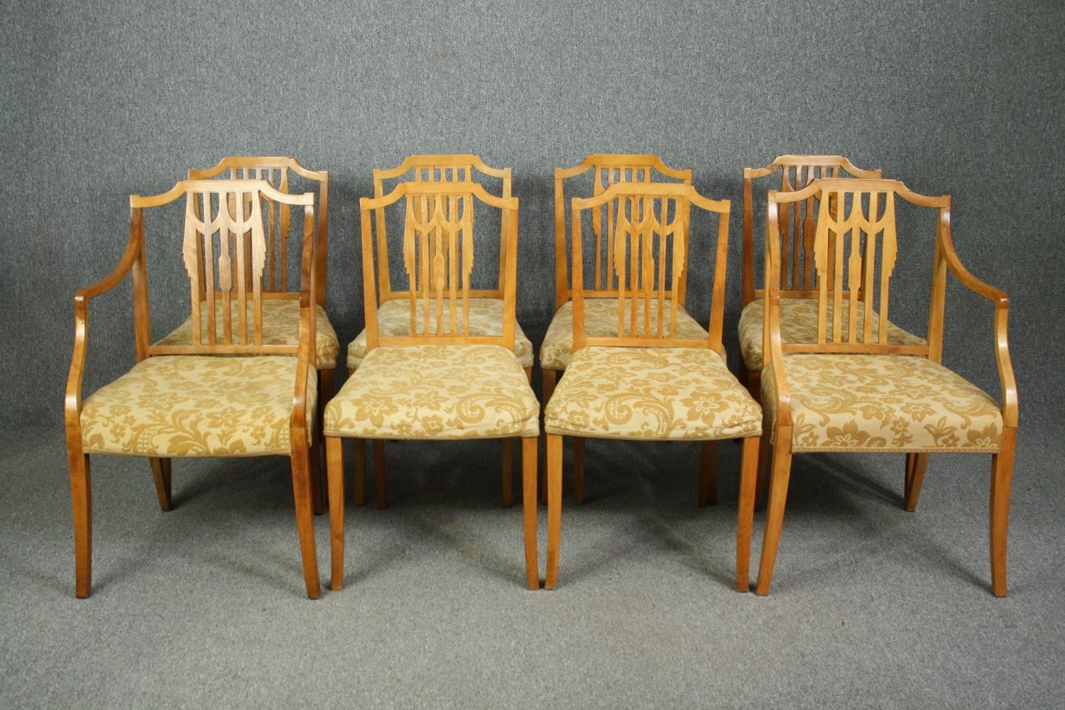 A set of eight Georgian style birch dining chairs to include two carver armchairs. (Repairs to the