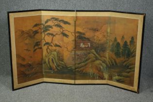 An early 20th century Japanese low screen with four gouache painted panels on a gilt background. H.