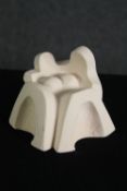 A fired clay figure group, abstract seated couple. H.11cm.