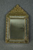 Wall mirror, 19th century Flemish cushion framed with repousse metal cresting and bevelled plate.