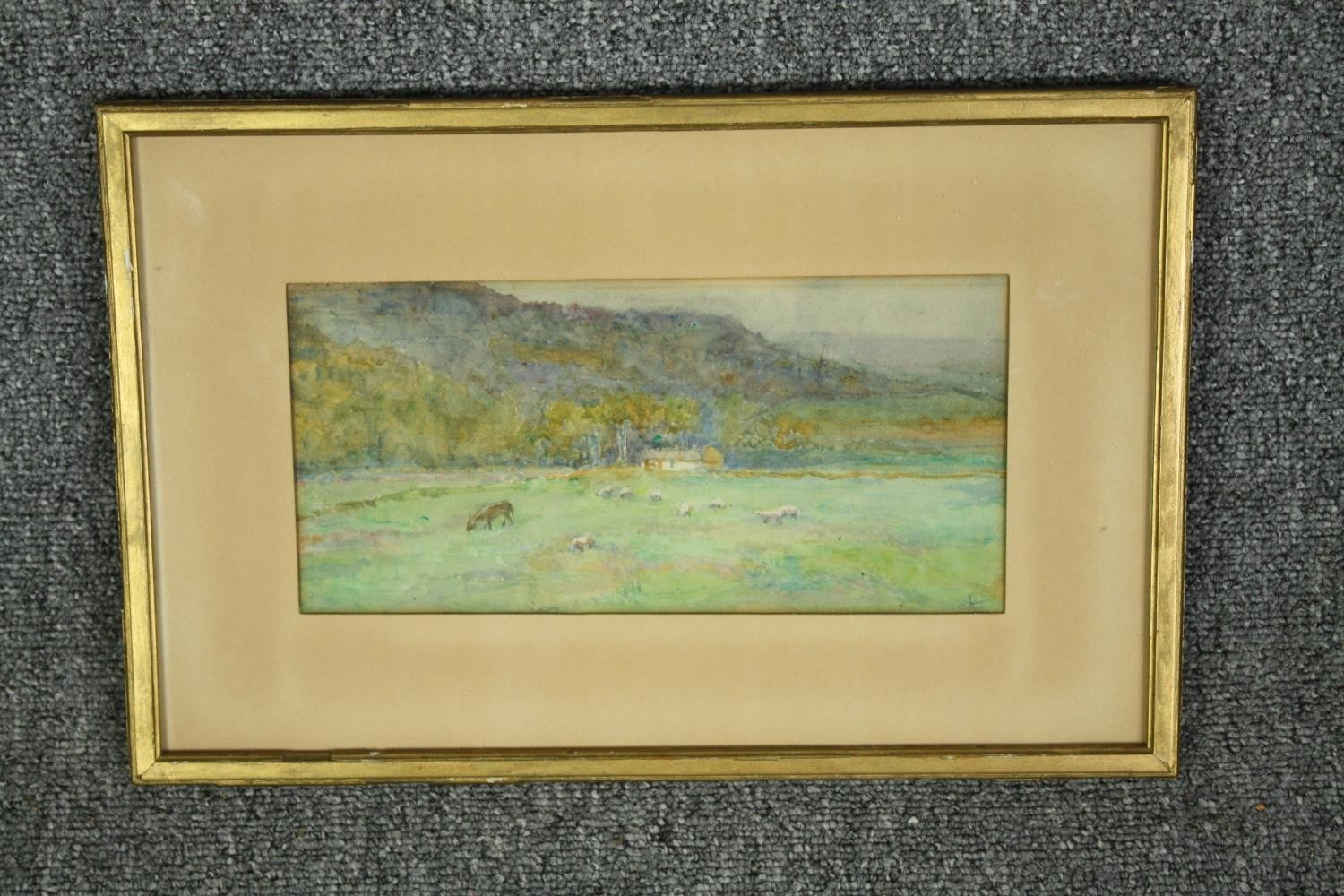 A framed and glazed watercolour, rural landscape with sheep, initialled bottom right. H.26 W.39cm. - Image 2 of 4