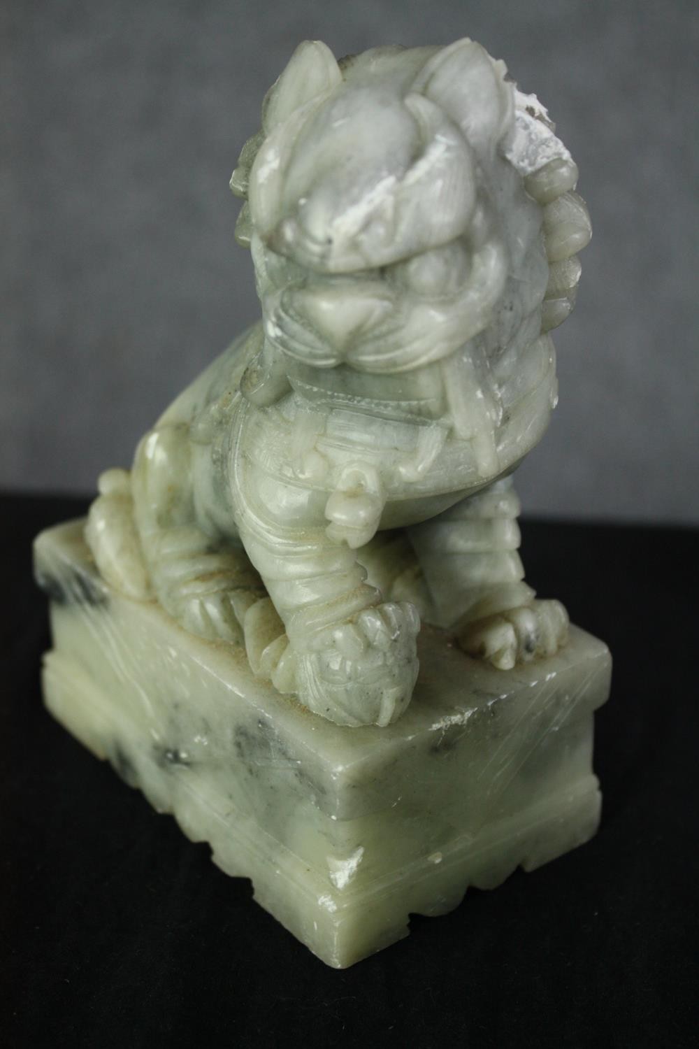 A pair of Chinese carved soapstone foo dogs. H.14cm. (each). - Image 5 of 6