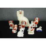 A collection of nine 19th century Staffordshire dogs. H.25cm. (largest)