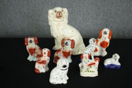 A collection of nine 19th century Staffordshire dogs. H.25cm. (largest)