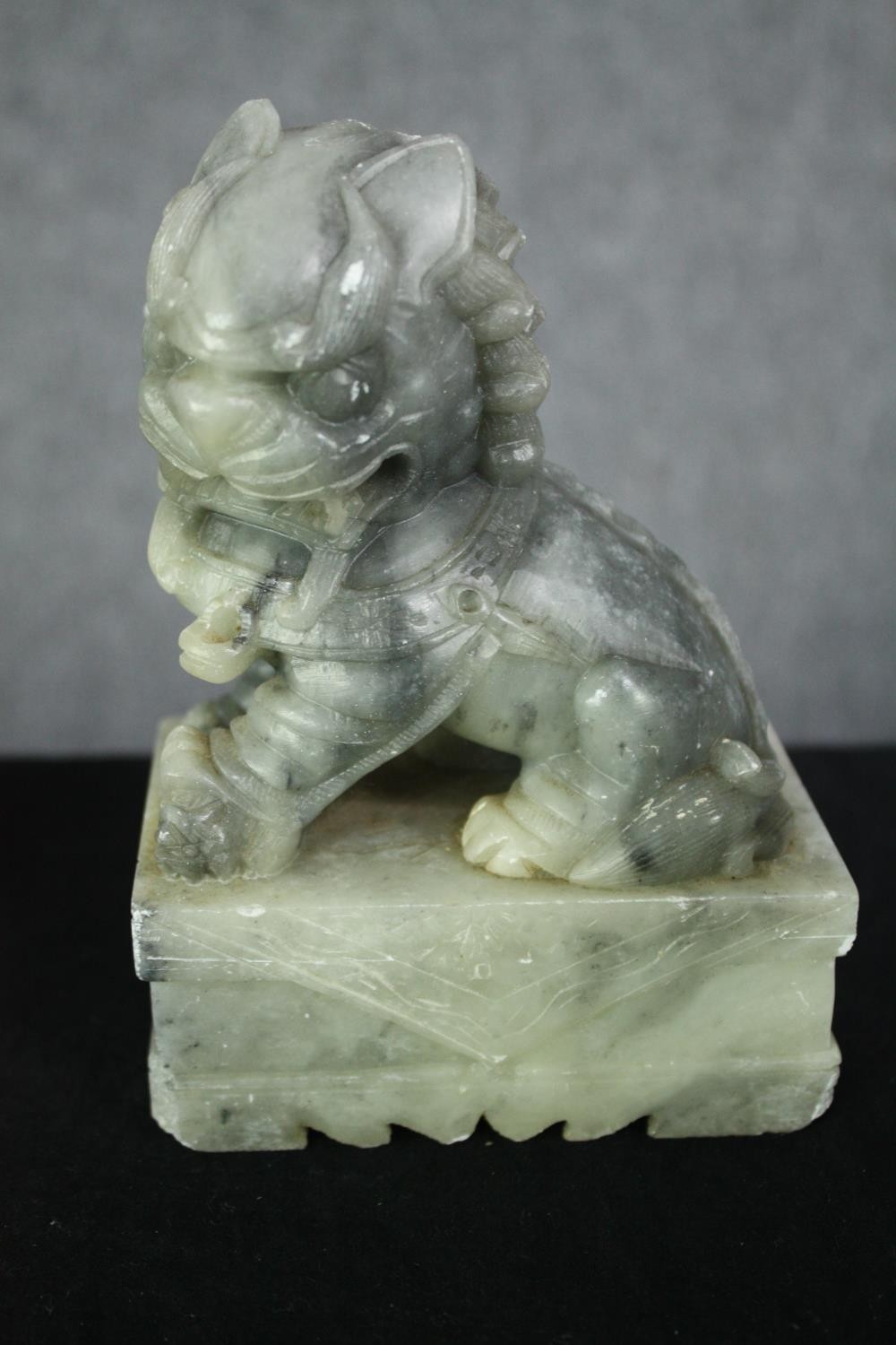 A pair of Chinese carved soapstone foo dogs. H.14cm. (each). - Image 2 of 6