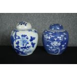 Two 19th century blue and white hand painted porcelain lidded ginger jars, one with a prunus blossom