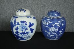 Two 19th century blue and white hand painted porcelain lidded ginger jars, one with a prunus blossom