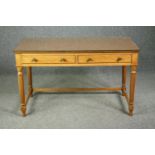 An early 19th century satinwood writing table with composite top under plate glass, stamped