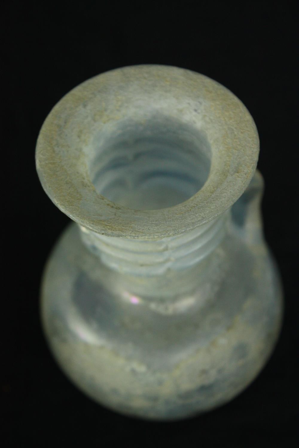 A Roman iridescent glass oil jug. H.12cm. - Image 5 of 8