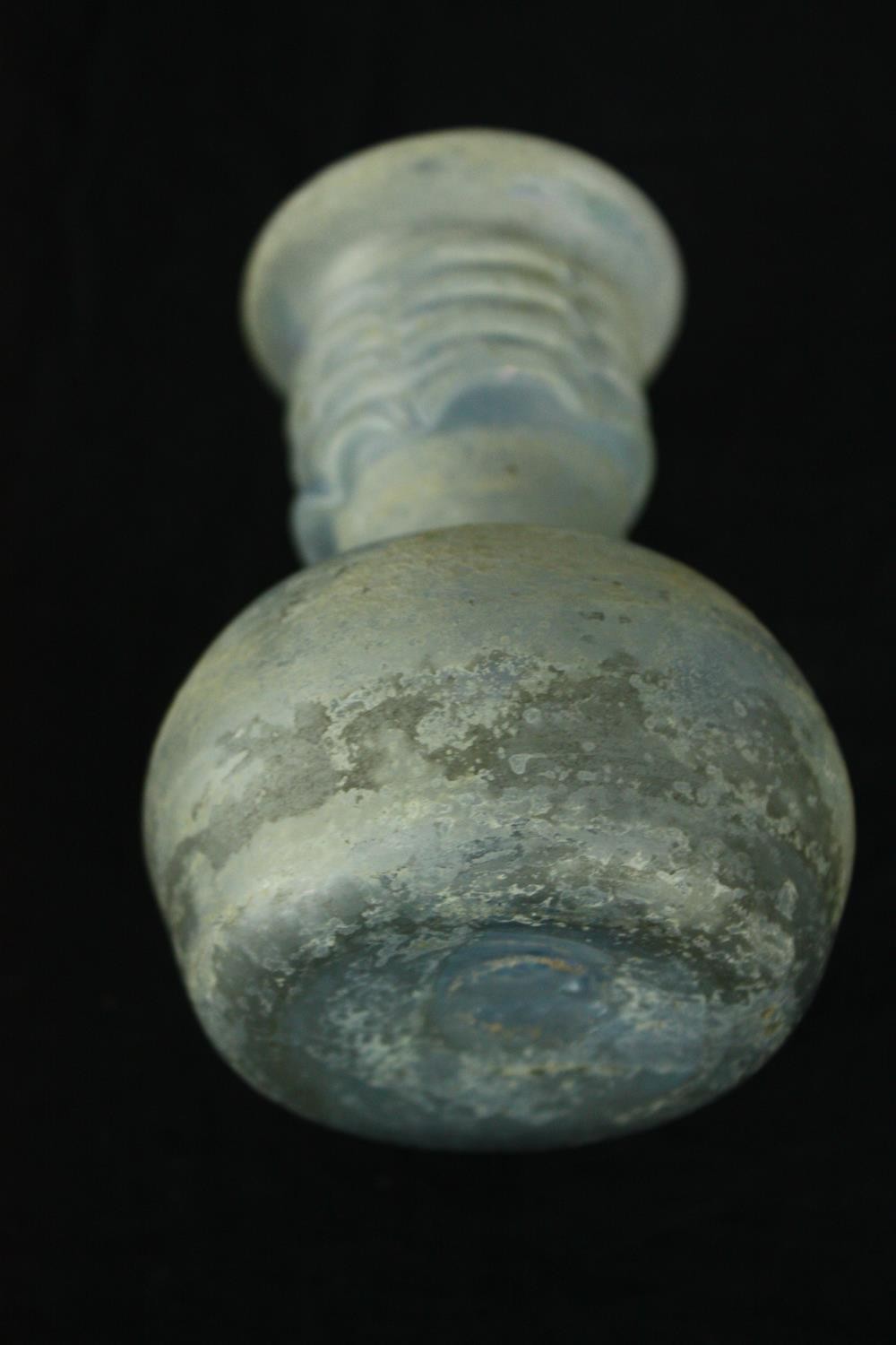 A Roman iridescent glass oil jug. H.12cm. - Image 7 of 8