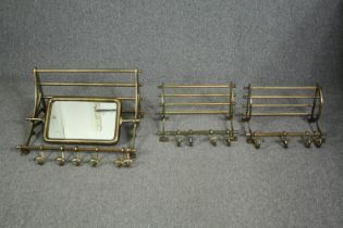 A pair of vintage style train compartment luggage racks along with a larger example fitted with